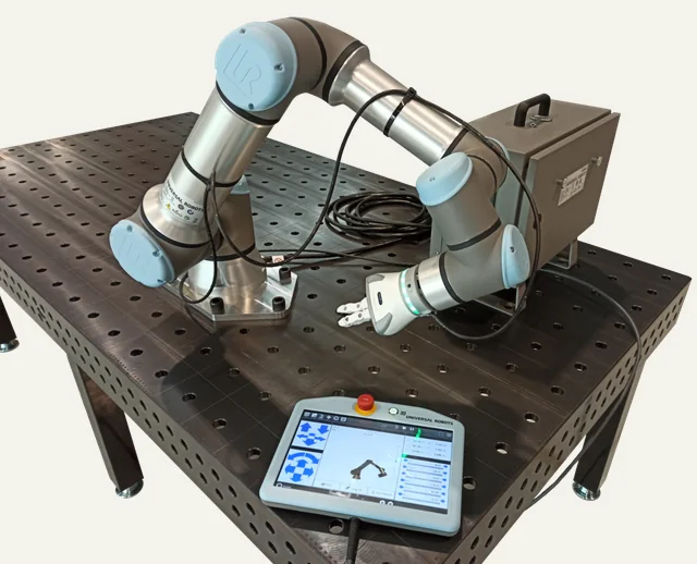 Reference photograph: UR16e robot arm.