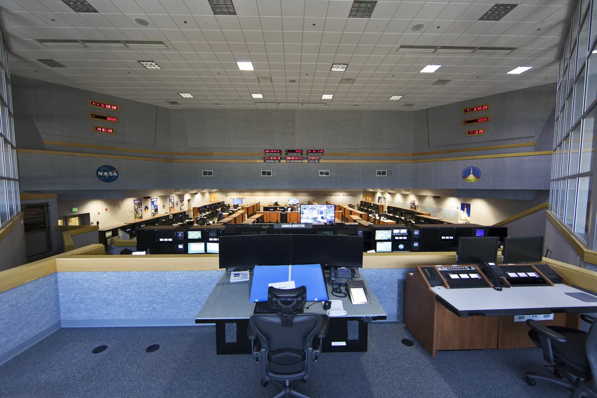 Photograph of an engineering control room with workstations.