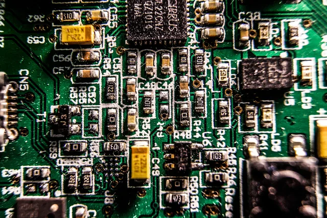 Close view of components on an electronic circuit board.